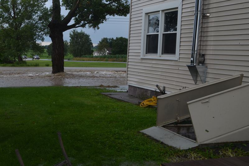 Cellar door and flooded basement after a flash flood in Canandaigua, New York