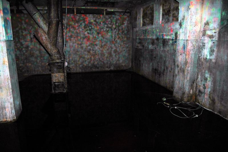 Flooded basement floor with standing water